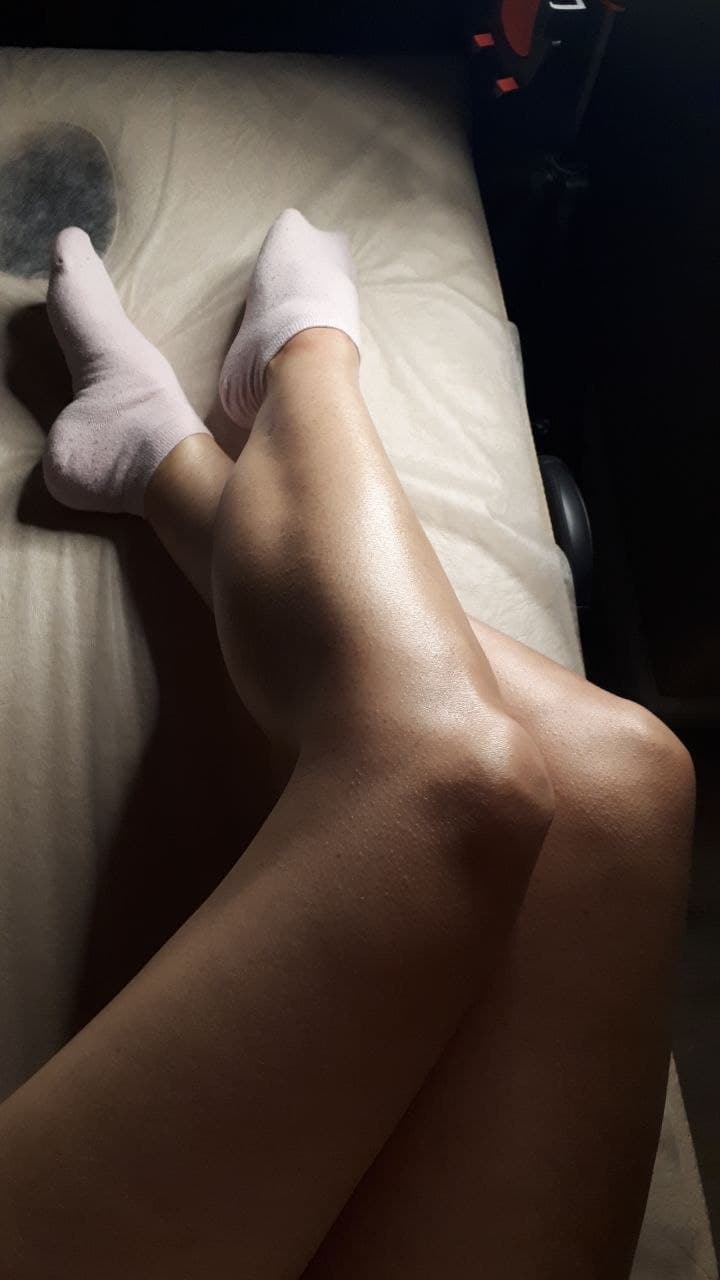 Client's legs on a treatment table after a professional waxing session